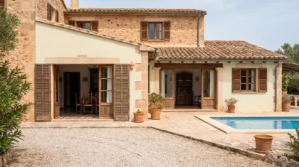 Mallorcan villa presented for a viewing with open shutters, a swept terrace and a clean pool