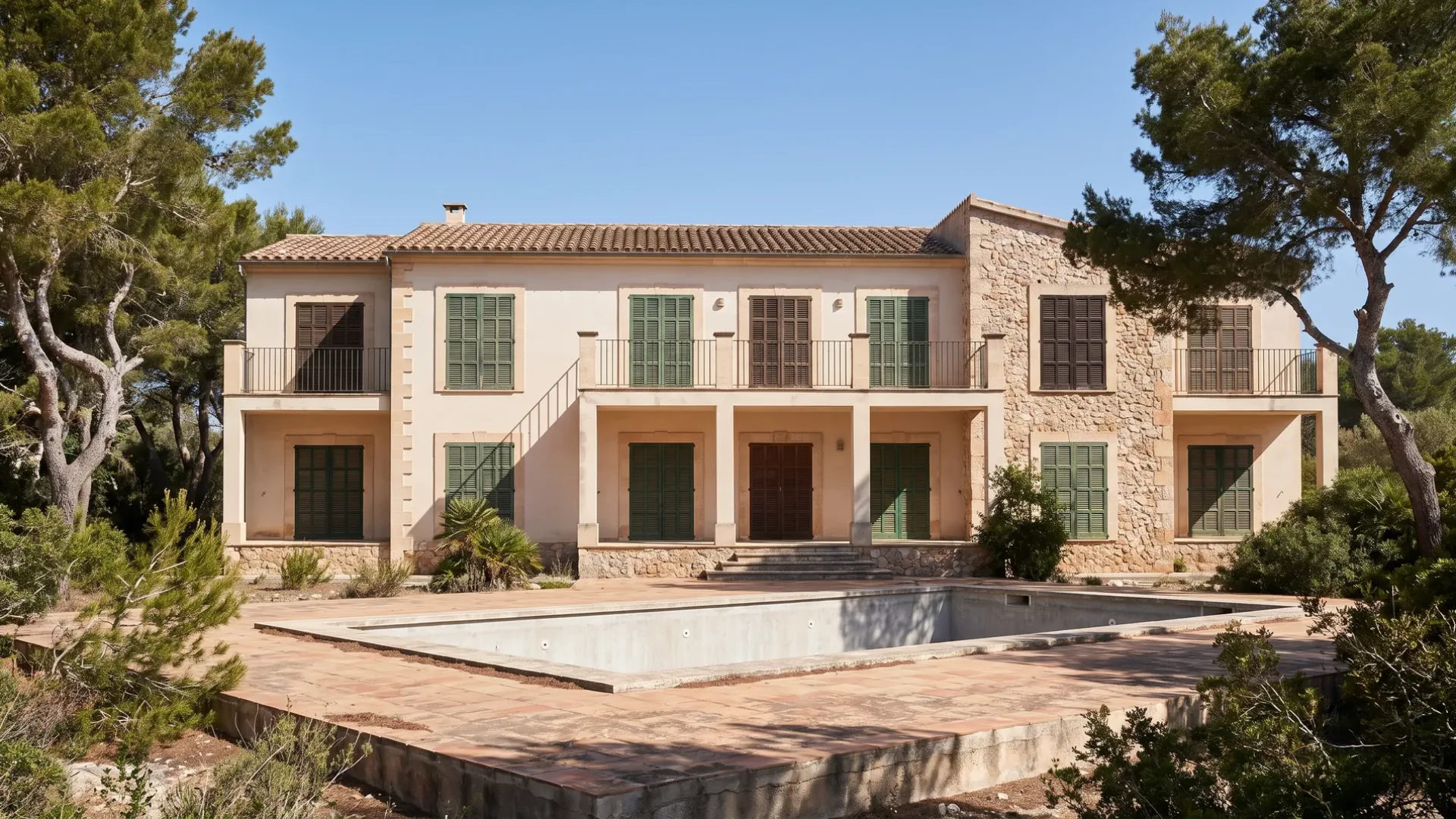 Low-rise Mallorcan coastal apartment building closed for the season with its shutters down