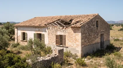Old Mallorcan house standing empty with a part-collapsed roof and its thick stone walls intact